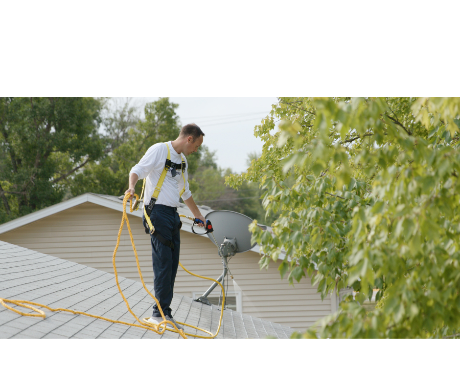 Salvation Roofing technician working safely with full fall protection